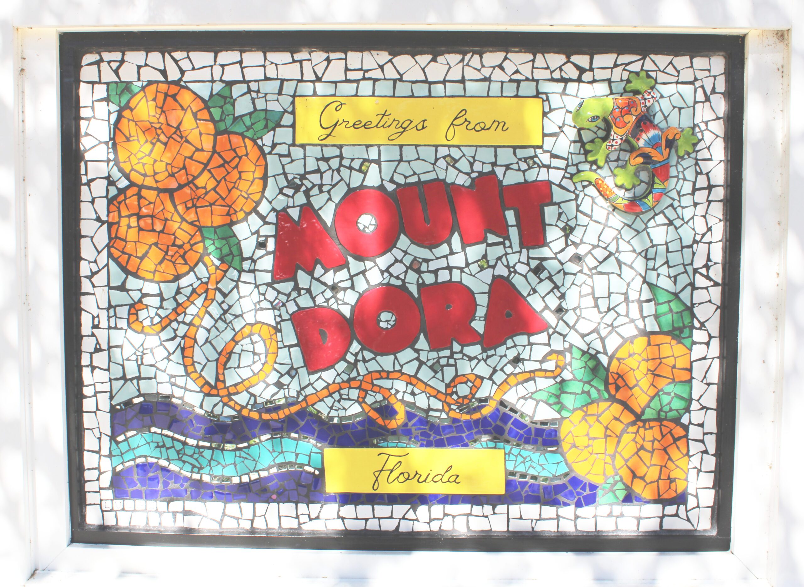 Close-up of the Mount Dora mosaic welcome sign in Sunset Park